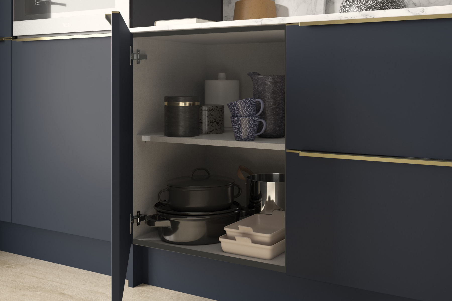 Urban indigo with open door filled with crockery and pans, with brass coloured inline trim running along the top of the door